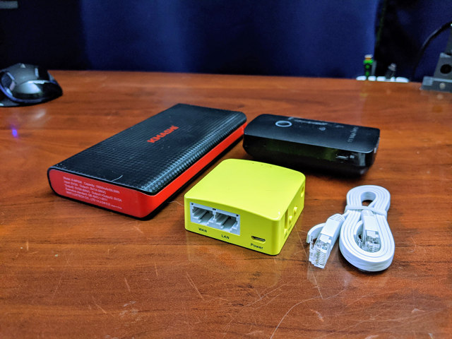 The GL.iNet Mango with my phone, Kmashi USB battery, and my old RavPower FileHub Plus