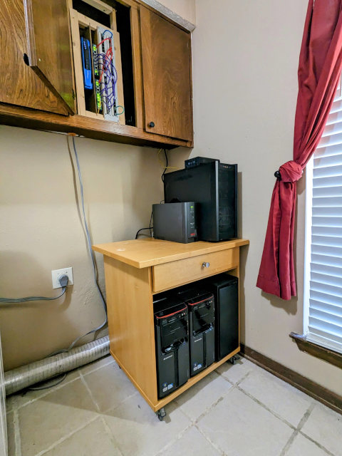 My homelab server under my network cupboard